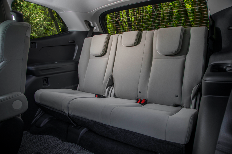 Third row with the headrests down, where they will poke your back in an uncomfortable way.